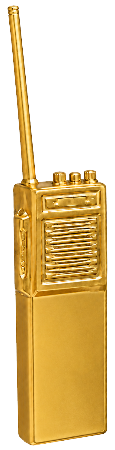 The Golden Brick: a brick-style handheld radio painted gold, the club's highest honor.