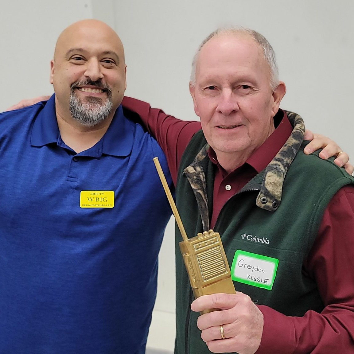 Smitty, WB1G, presenting the Golden Brick to Greydon Hicks at the 2023 SFARC Christmas Party.