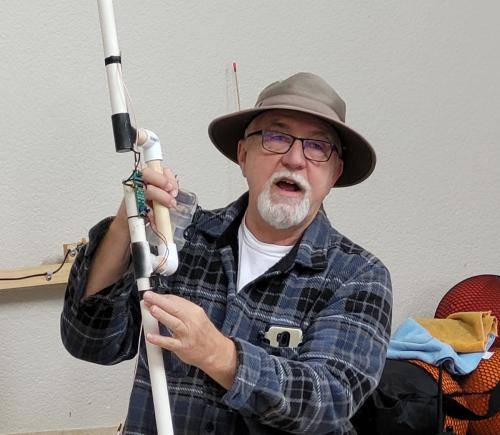 Doug (W2VX) showing off his RDF gear at the Radio Direction Finding build workshop.