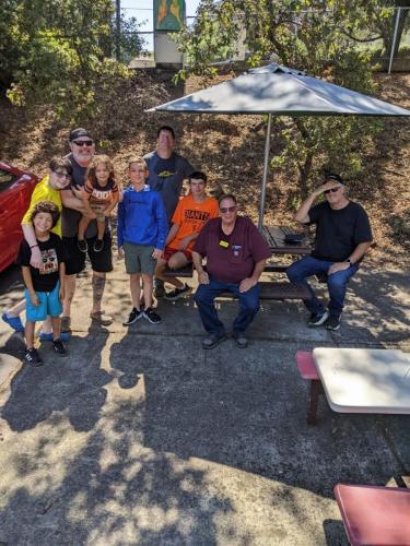 Hidden at Robie Point in Auburn, a big thanks to Chris (N6CTC) and his boy Jaxon. Pictured: Evan Phillips (AJ6OR), Stephen Foley (KO6EBQ), and Frank (KG9M) (August 31, 2024)